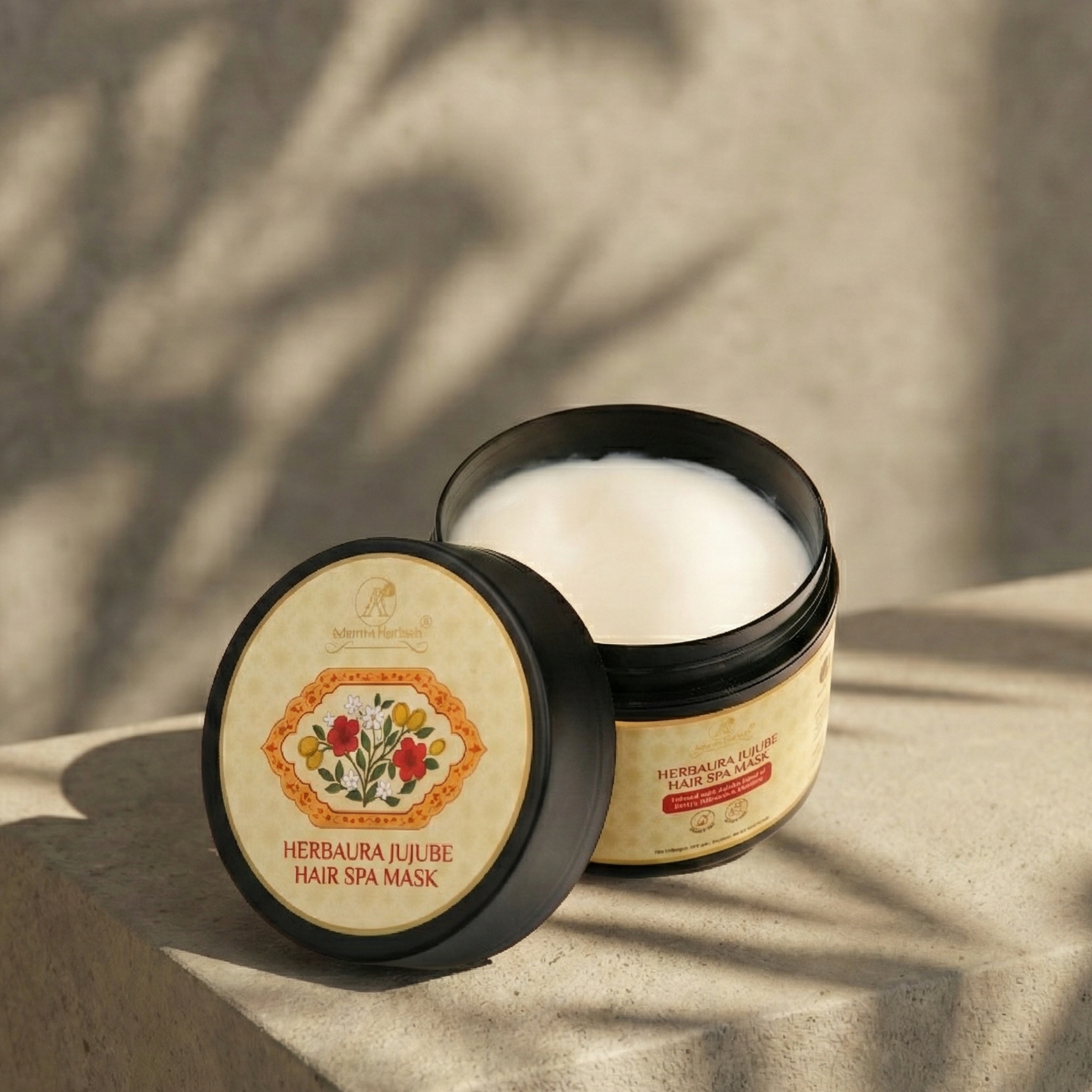 Hair spa mask container with lid open on a textured surface with leaf shadows